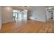 Living room with hardwood floors, built-in shelves, and view of the water at 5200 Masons Ferry Rd, Clover, SC 29710