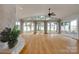 Bright living room featuring hardwood floors, ceiling fan and water views at 5200 Masons Ferry Rd, Clover, SC 29710