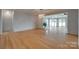 Spacious living room featuring hardwood floors and a view of the water at 5200 Masons Ferry Rd, Clover, SC 29710