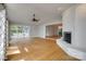 Living room with hardwood floors, fireplace, and access to outdoor patio at 5200 Masons Ferry Rd, Clover, SC 29710