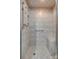 Shower featuring a built-in bench, updated shower head, and designer tile work at 5200 Masons Ferry Rd, Clover, SC 29710