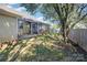 Enjoy the outdoors in the screened porch with a patio, large backyard and a wooden fence at 5804 Crosswinds Ct, Indian Trail, NC 28079