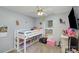 Cozy bedroom with gray walls, carpet, a ceiling fan, and a loft bed at 5804 Crosswinds Ct, Indian Trail, NC 28079