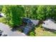 An aerial view of a charming single-story home surrounded by lush greenery and neighboring houses at 634 7Th Avenue Se Pl, Hickory, NC 28602