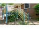 Staircase leading to the backyard with colorful flowering bushes at 634 7Th Avenue Se Pl, Hickory, NC 28602