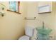 Stylish half-bathroom featuring a unique glass vessel sink, modern fixtures, and neutral tones at 634 7Th Avenue Se Pl, Hickory, NC 28602