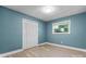 Cozy bedroom with newly installed floors, a bright window, fresh paint, and a closet with ample storage at 634 7Th Avenue Se Pl, Hickory, NC 28602