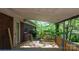 A covered wooden deck off the back of the house with a view of mature trees at 634 7Th Avenue Se Pl, Hickory, NC 28602