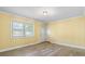 Bright living room featuring new flooring, neutral paint, a stylish light fixture, and ample natural light at 634 7Th Avenue Se Pl, Hickory, NC 28602