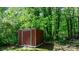 Durable storage shed surrounded by trees on this spacious property at 634 7Th Avenue Se Pl, Hickory, NC 28602