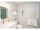 Bathroom with crisp white vanity, neutral walls, and bright natural light at 6425 High Creek Ct, Charlotte, NC 28277