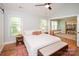 Bedroom boasts a ceiling fan, hardwood floors, vaulted ceilings, and access to a sunroom at 6425 High Creek Ct, Charlotte, NC 28277