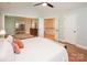 Bedroom featuring vaulted ceilings, hardwood floors, access to a sauna, and neutral paint at 6425 High Creek Ct, Charlotte, NC 28277