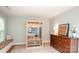 Bedroom view with a personal sauna, a chest of drawers, bench seating, and light green walls at 6425 High Creek Ct, Charlotte, NC 28277