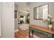 Bright bonus room showcases hardwood floors and desk area with natural light at 6425 High Creek Ct, Charlotte, NC 28277