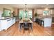 Dining room with a large wooden table, chandelier, and open view to the kitchen at 6425 High Creek Ct, Charlotte, NC 28277