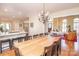 An open concept floor plan featuring a dining room with seating for eight and hardwood floors throughout at 6425 High Creek Ct, Charlotte, NC 28277
