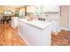 Kitchen with white cabinets, granite countertops, an island, and stainless steel appliances at 6425 High Creek Ct, Charlotte, NC 28277