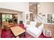 Open-concept living area with hardwood floors, a staircase, and seamless flow to the kitchen at 6425 High Creek Ct, Charlotte, NC 28277