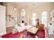 Bright living room with vaulted ceilings, hardwood floors, a staircase, and a cozy seating area at 6425 High Creek Ct, Charlotte, NC 28277