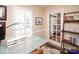 Office space featuring custom shutters, glass French doors and decorative shelving at 6425 High Creek Ct, Charlotte, NC 28277