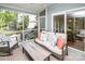 Inviting screened porch with cozy furniture and neighborhood views at 6425 High Creek Ct, Charlotte, NC 28277