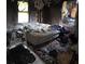 Burned and damaged bedroom with debris and a scorched mattress at 721 S Spruce St, Rock Hill, SC 29730