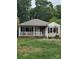 Charming single-story home with a cozy front porch, though it appears damaged from fire at 721 S Spruce St, Rock Hill, SC 29730
