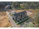 Aerial view of modern townhomes with construction progress and neighborhood amenities in the background at 722 Falling Oak Aly # 20, Huntersville, NC 28078