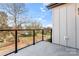 Exterior view from the balcony with sleek black railing and neighborhood view at 722 Falling Oak Aly # 20, Huntersville, NC 28078