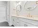 Bathroom featuring a double sink vanity, stylish mirrors, and modern fixtures at 722 Falling Oak Aly # 20, Huntersville, NC 28078