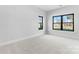 Bright bedroom with plush carpeting, neutral walls, and modern windows at 722 Falling Oak Aly # 20, Huntersville, NC 28078
