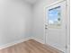 Bright entryway with wood flooring and a view of the exterior through a glass-paneled door at 722 Falling Oak Aly # 20, Huntersville, NC 28078