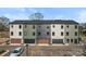 Modern townhome exteriors feature attached garages, and contemporary color schemes at 722 Falling Oak Aly # 20, Huntersville, NC 28078