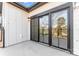 Private patio with sliding glass doors offering views of the neighborhood at 722 Falling Oak Aly # 20, Huntersville, NC 28078