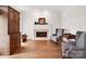 Cozy living room with fireplace, hardwood floors, and natural light at 7716 Seton House Ln, Charlotte, NC 28277