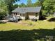 Exterior back view featuring a deck, air conditioner and yard at 8000 Tiburon Cir, Charlotte, NC 28215