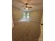 Spacious bedroom with neutral walls, plush carpeting, and a ceiling fan at 8000 Tiburon Cir, Charlotte, NC 28215
