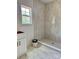 Bathroom featuring new vanity, large shower with marble tiling, and natural light at 85 Cornerstone Dr, Taylorsville, NC 28681