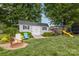 Backyard shed featuring outdoor chairs, a fire pit, and a play set at 878 Cold Springs Rd, Concord, NC 28025