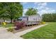 Home exterior showing deck, nice landscaping, and play area at 878 Cold Springs Rd, Concord, NC 28025