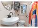 Cozy bathroom with modern fixtures, a round mirror, and a colorful shower curtain at 878 Cold Springs Rd, Concord, NC 28025