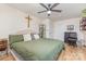 Comfortable bedroom with a ceiling fan, desk, and display case at 878 Cold Springs Rd, Concord, NC 28025