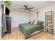 Spacious bedroom with hardwood floors, ceiling fan, and display case at 878 Cold Springs Rd, Concord, NC 28025