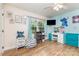 Bright bedroom featuring hardwood floors, a window, a vanity, and creative decor at 878 Cold Springs Rd, Concord, NC 28025