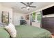 Bright bedroom with ceiling fan, large window, and dresser at 878 Cold Springs Rd, Concord, NC 28025