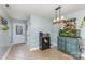 Charming dining area with stylish light fixture, beverage center, and a unique aquarium display at 878 Cold Springs Rd, Concord, NC 28025
