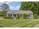 Charming home with well-maintained lawn, mature trees and established landscaping at 878 Cold Springs Rd, Concord, NC 28025