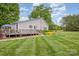 Charming home with a well-maintained lawn and spacious deck, perfect for outdoor entertaining at 878 Cold Springs Rd, Concord, NC 28025