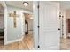 Hallway view showcases the home's floorplan, interior doors, and hardwood floors at 878 Cold Springs Rd, Concord, NC 28025